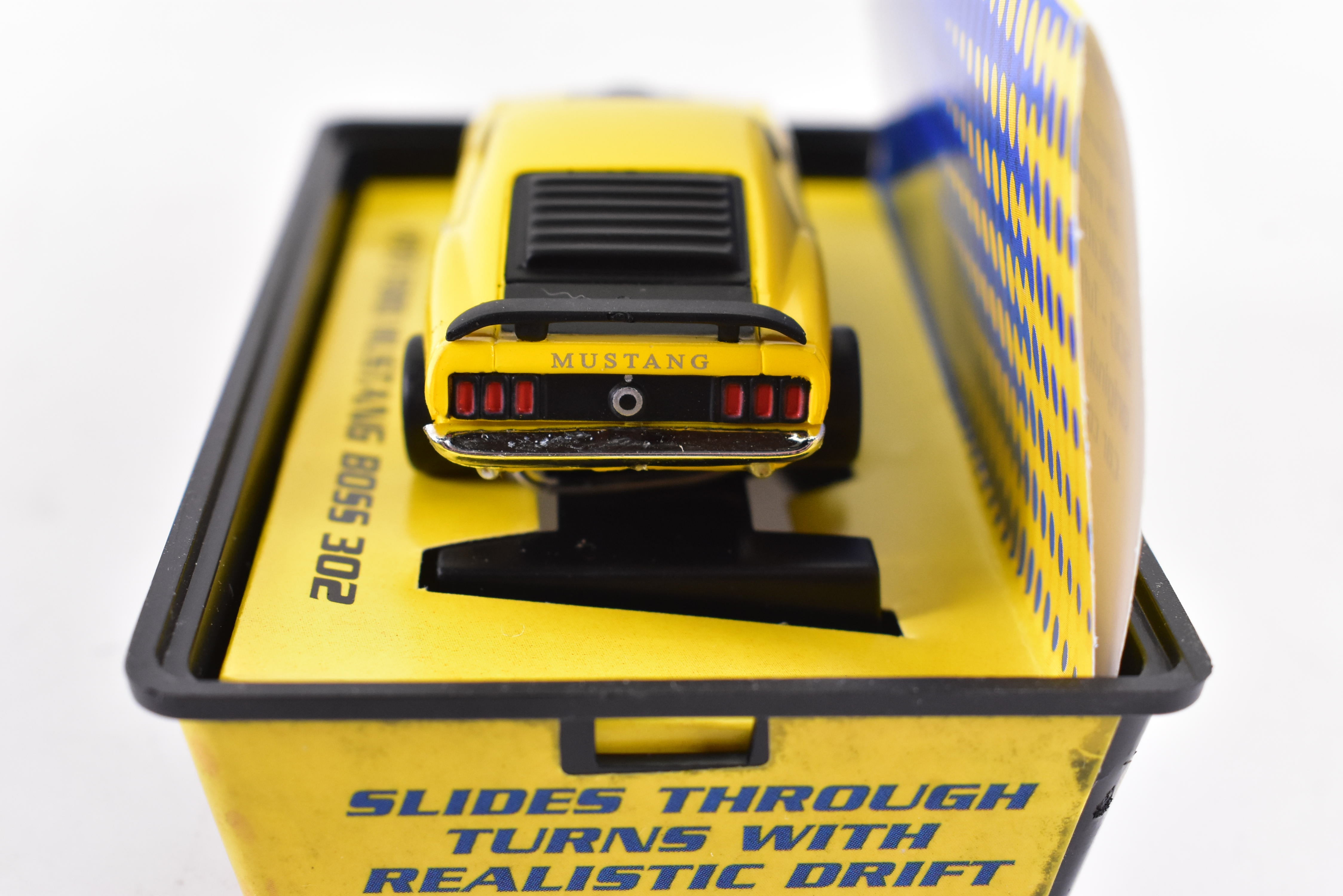 Unleash the Speed: 1970 Ford Mustang Boss 302 Yellow ThunderJet 500 Ho Scale Racer by Auto World