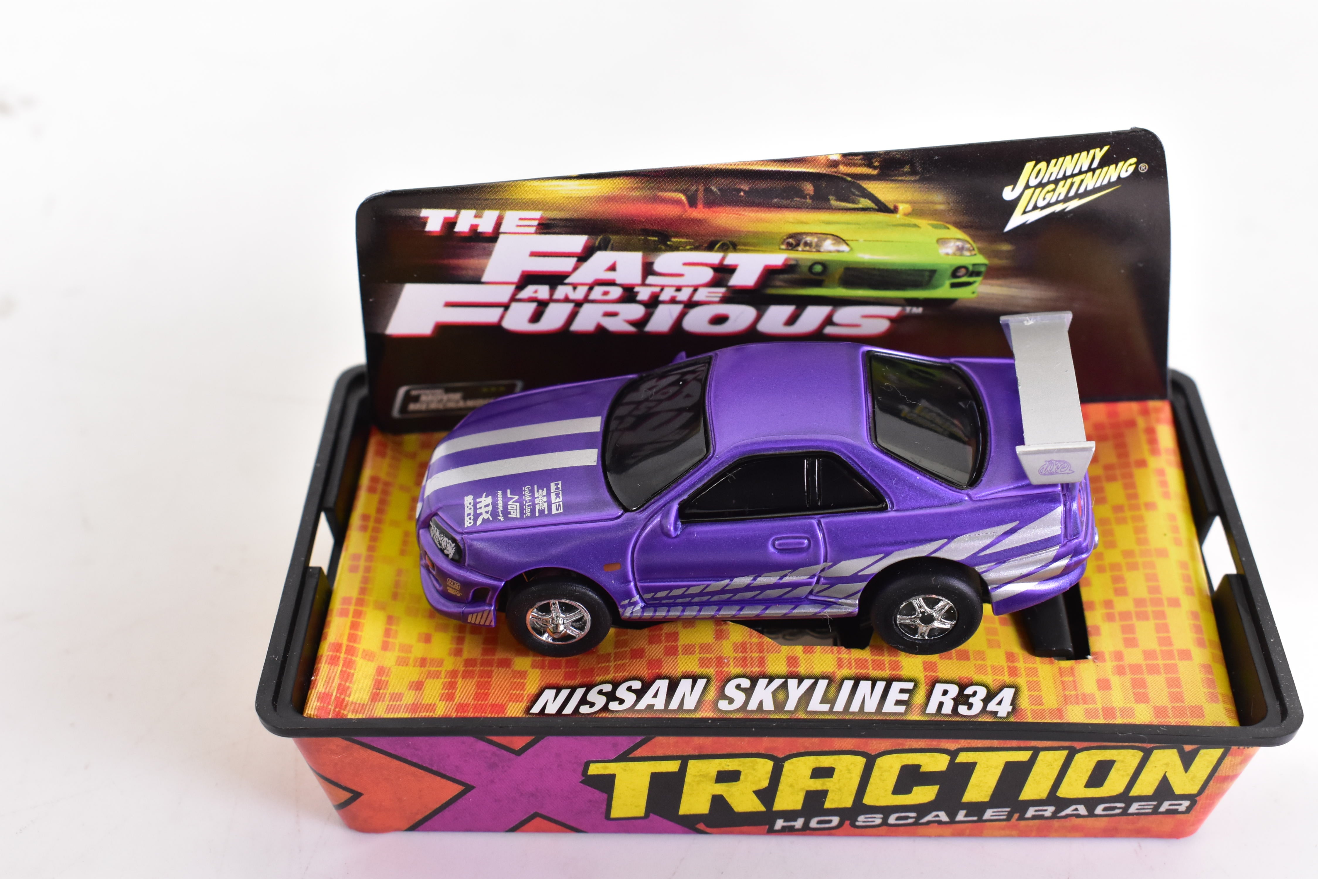 Get Your Hands on the Stunning Purple Nissan Skyline R34 Ho Scale Racer with Xtraction Chassis by Auto World! | 501 - 2