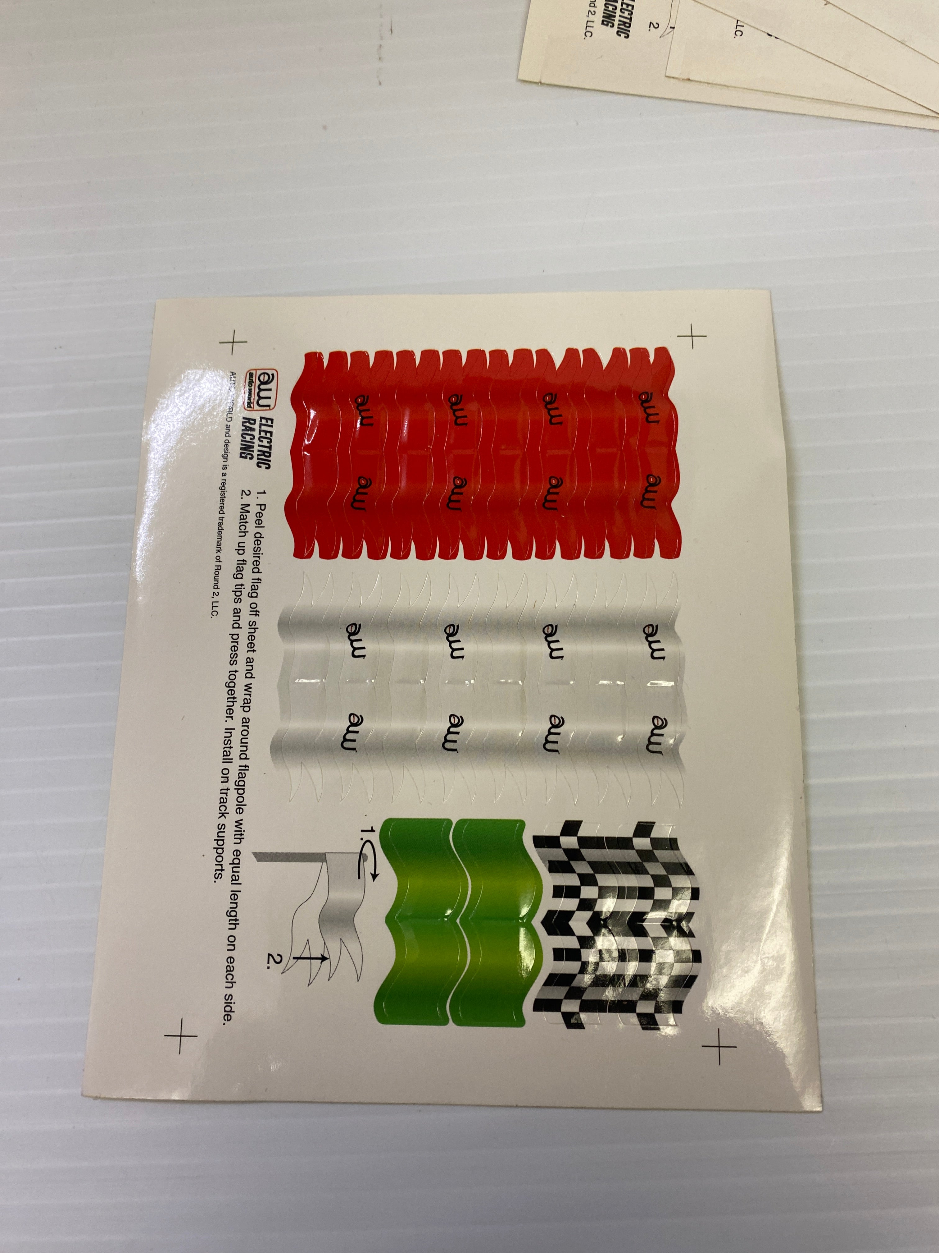 H.O. Scale Track Decals with Flags and Track Supports - TRX900: Essential Track & Car Accessories