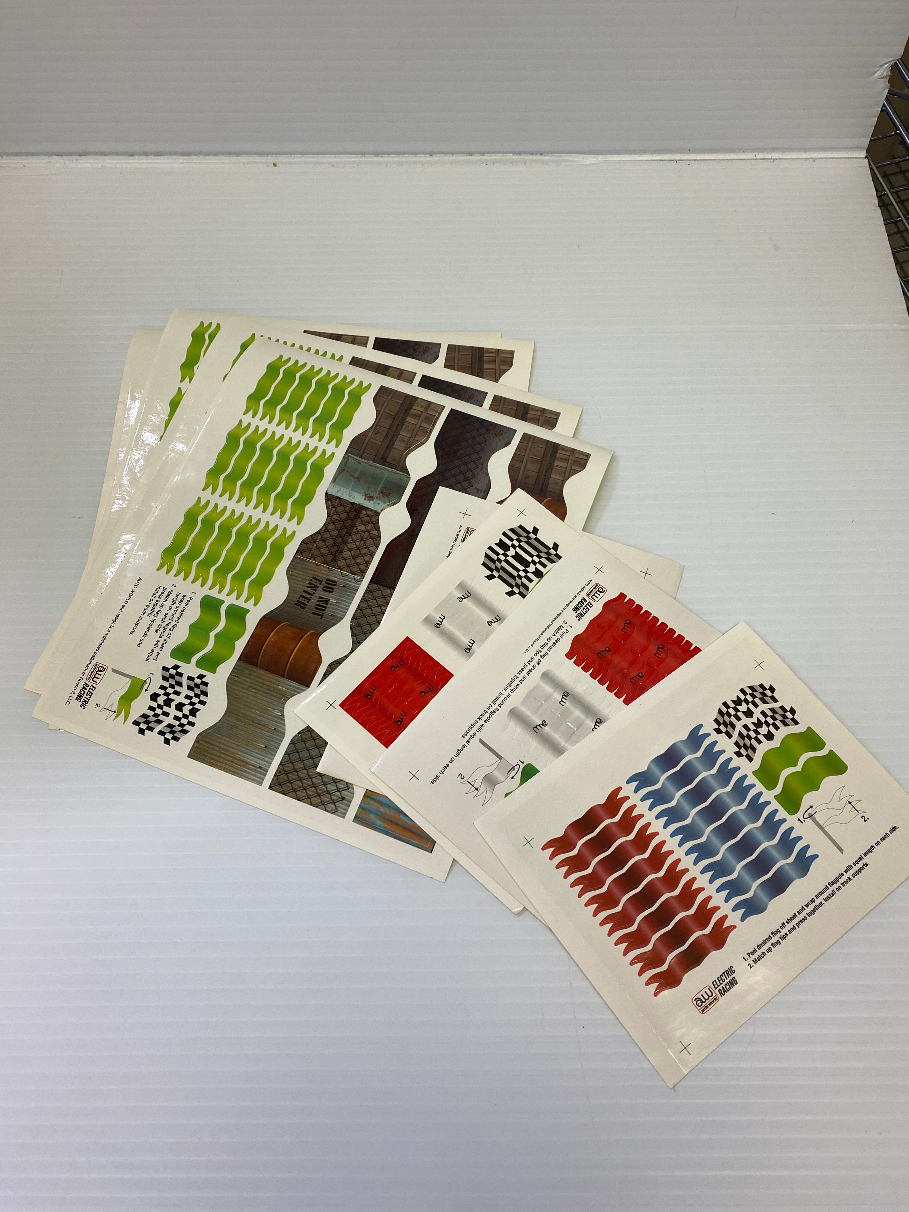 H.O. Scale Track Decals with Flags and Track Supports - TRX900: Essential Track & Car Accessories