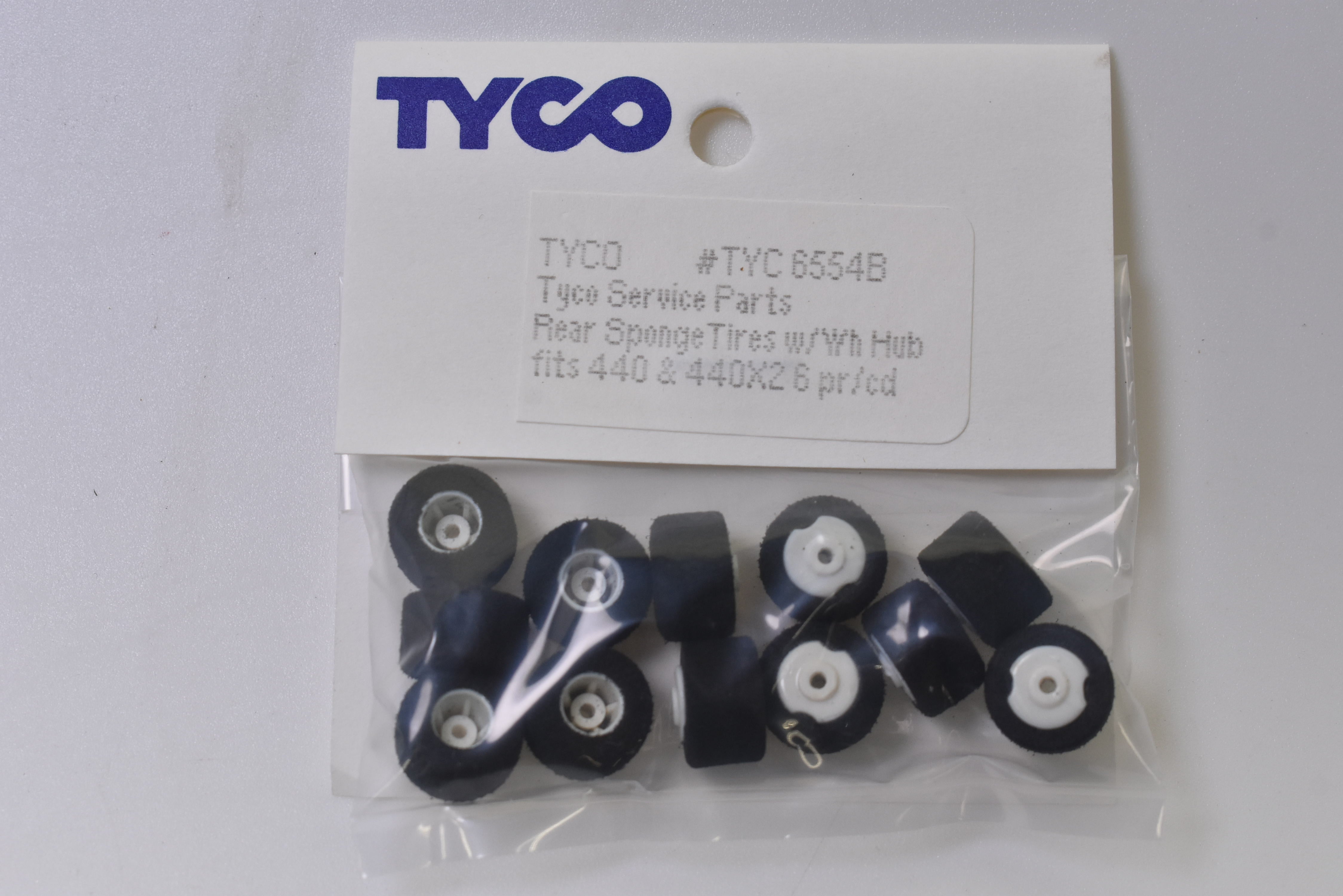 Tyco 440x2 Rear Sponge Tires w/Hub - 12 Pieces | 6554B - Upgrade Your Racing Experience!
