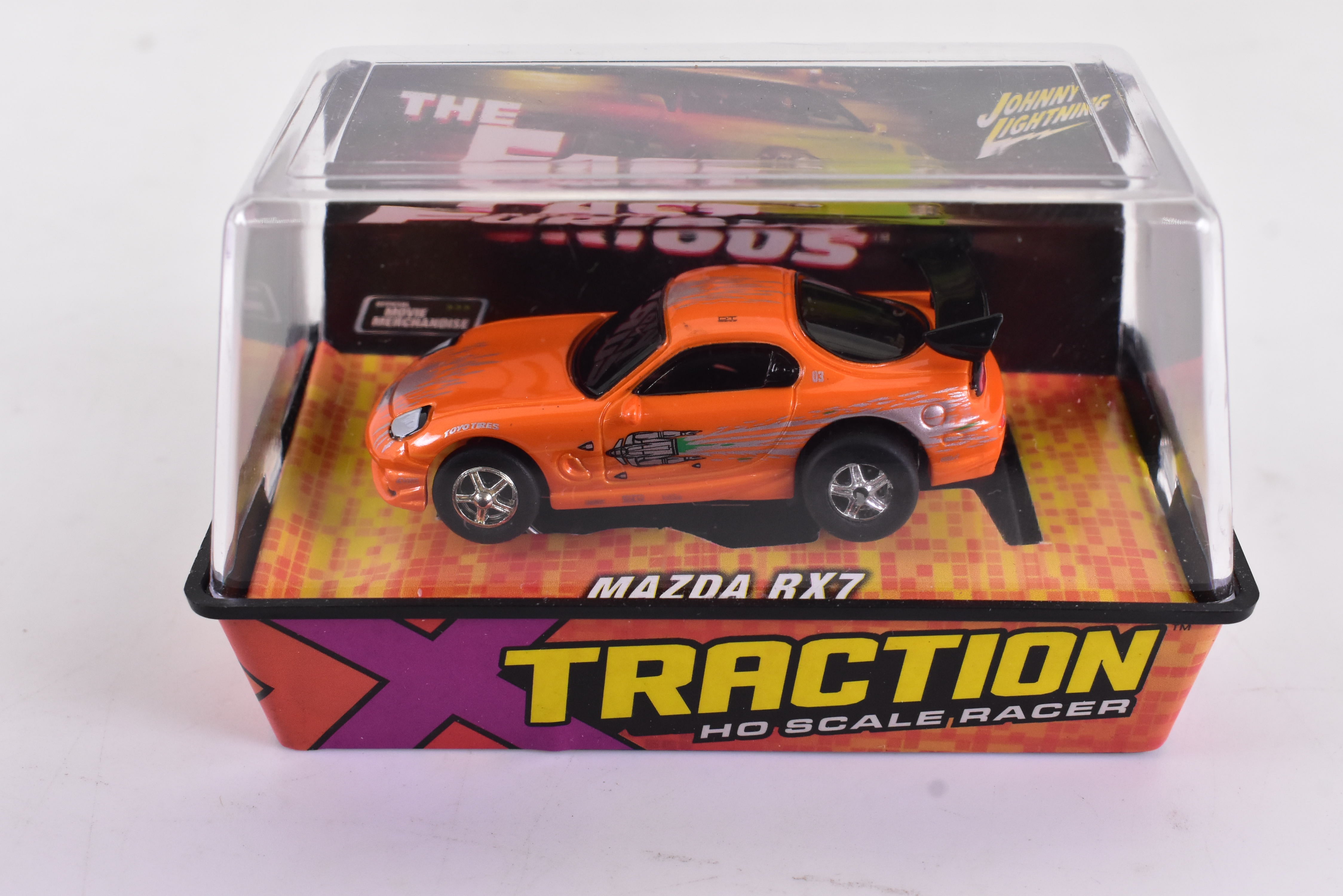 Get Your Hands on the Stunning Orange Mazda RX7 Ho Scale Racer with Xtraction Chassis! | 503-6 | Auto World