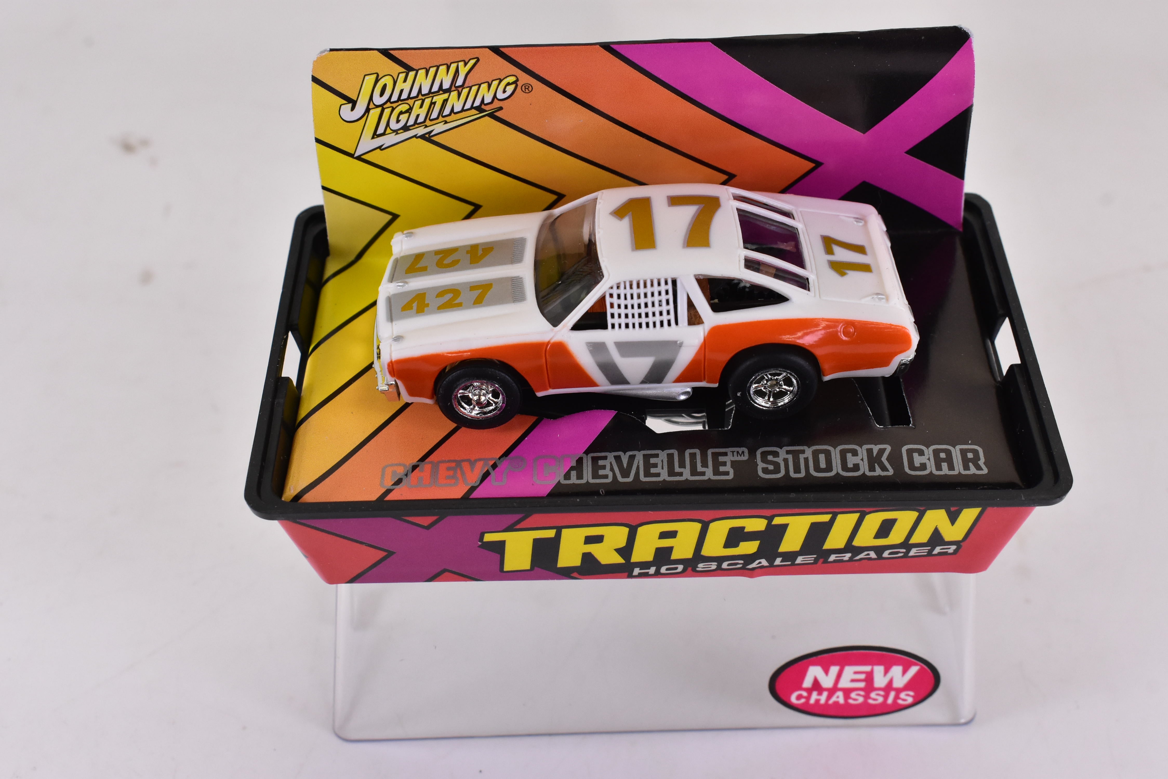 Unleash the Speed: Orange Chevy Chevelle Stock Car Ho Scale Racer with Xtraction Chassis | Auto World 401-9