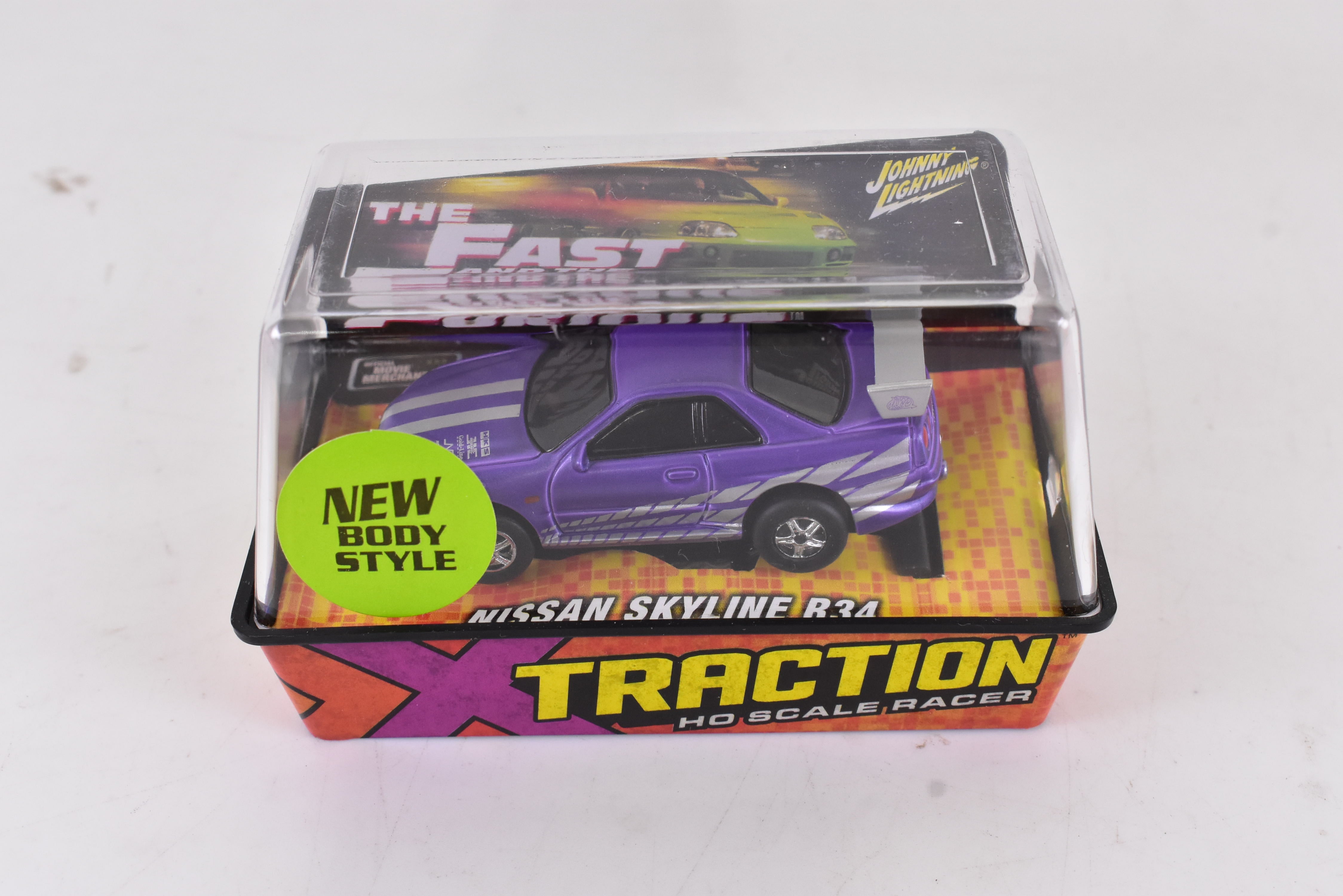 Get Your Hands on the Stunning Purple Nissan Skyline R34 Ho Scale Racer with Xtraction Chassis by Auto World! | 501 - 2