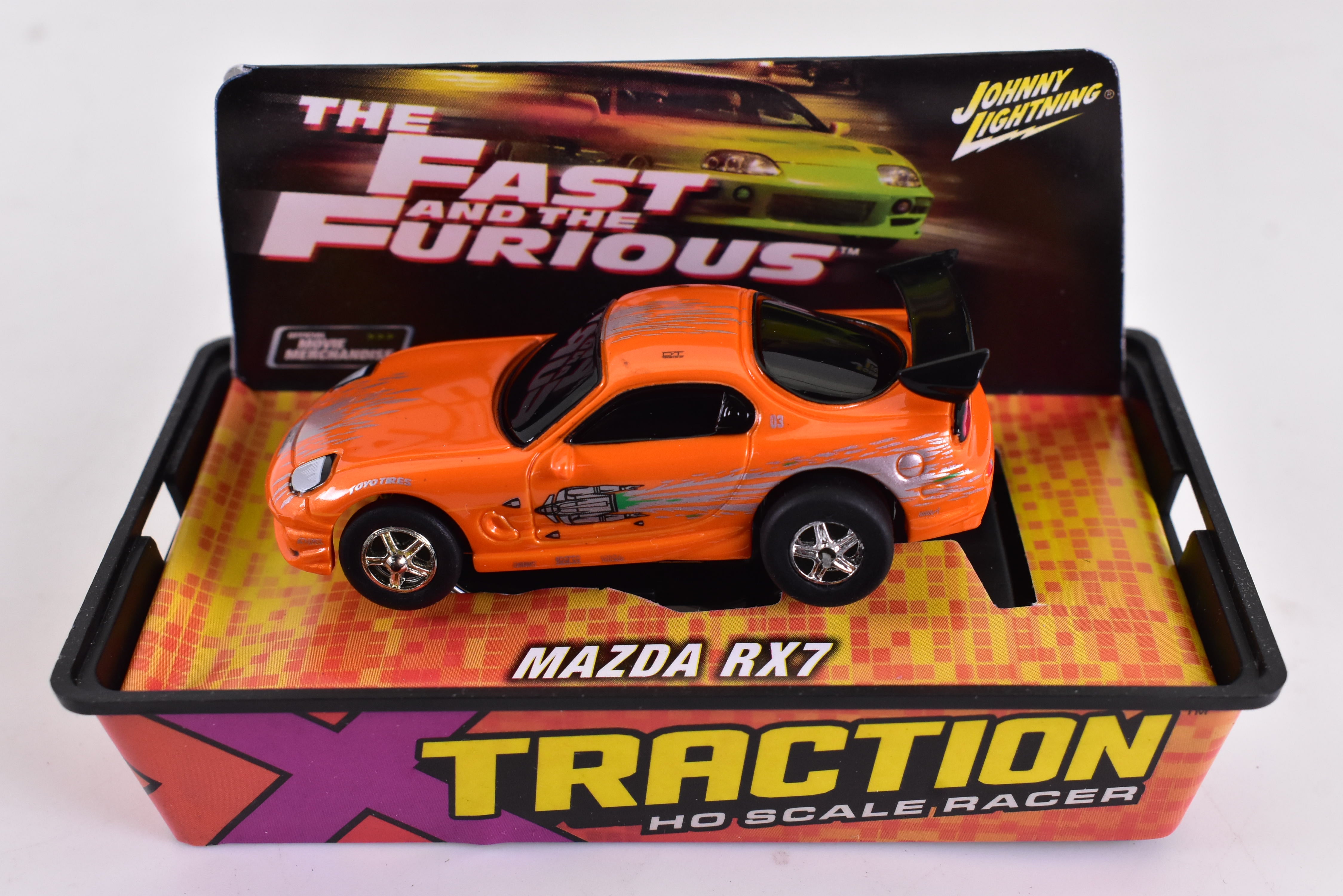 Get Your Hands on the Stunning Orange Mazda RX7 Ho Scale Racer with Xtraction Chassis! | 503-6 | Auto World