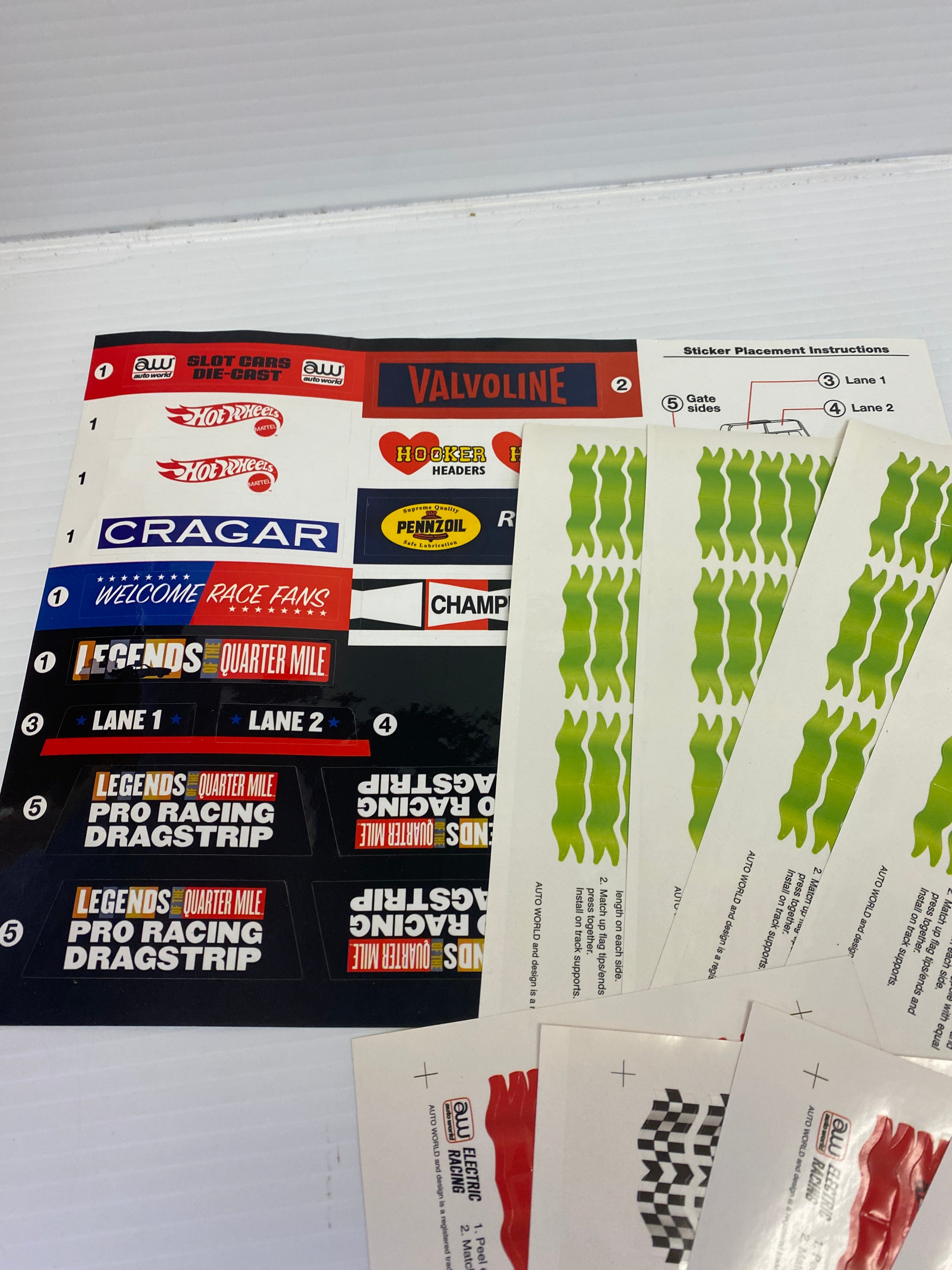 H.O. Scale Track Decals with Flags and Track Supports - TRX900: Essential Track & Car Accessories