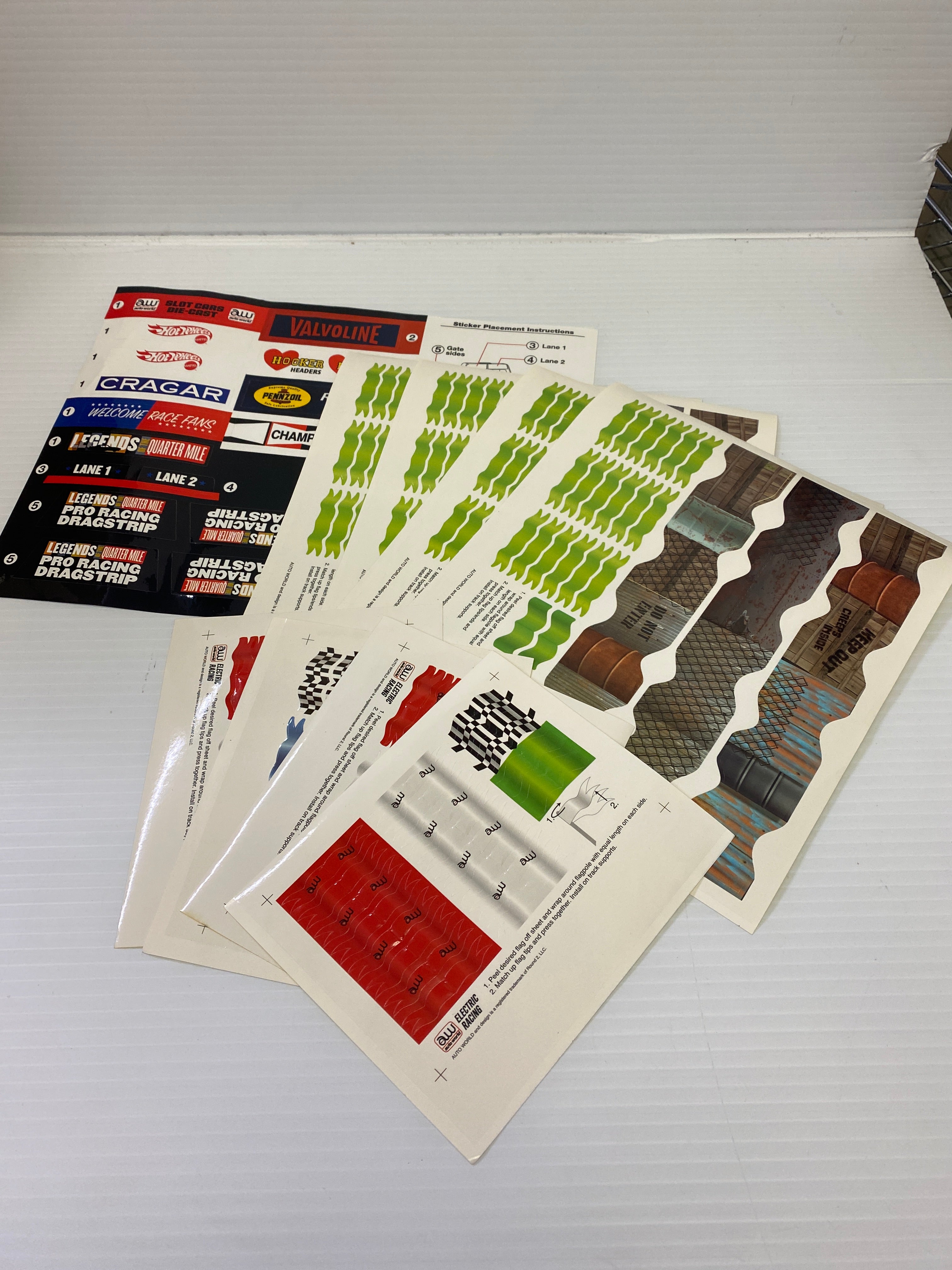 H.O. Scale Track Decals with Flags and Track Supports - TRX900: Essential Track & Car Accessories