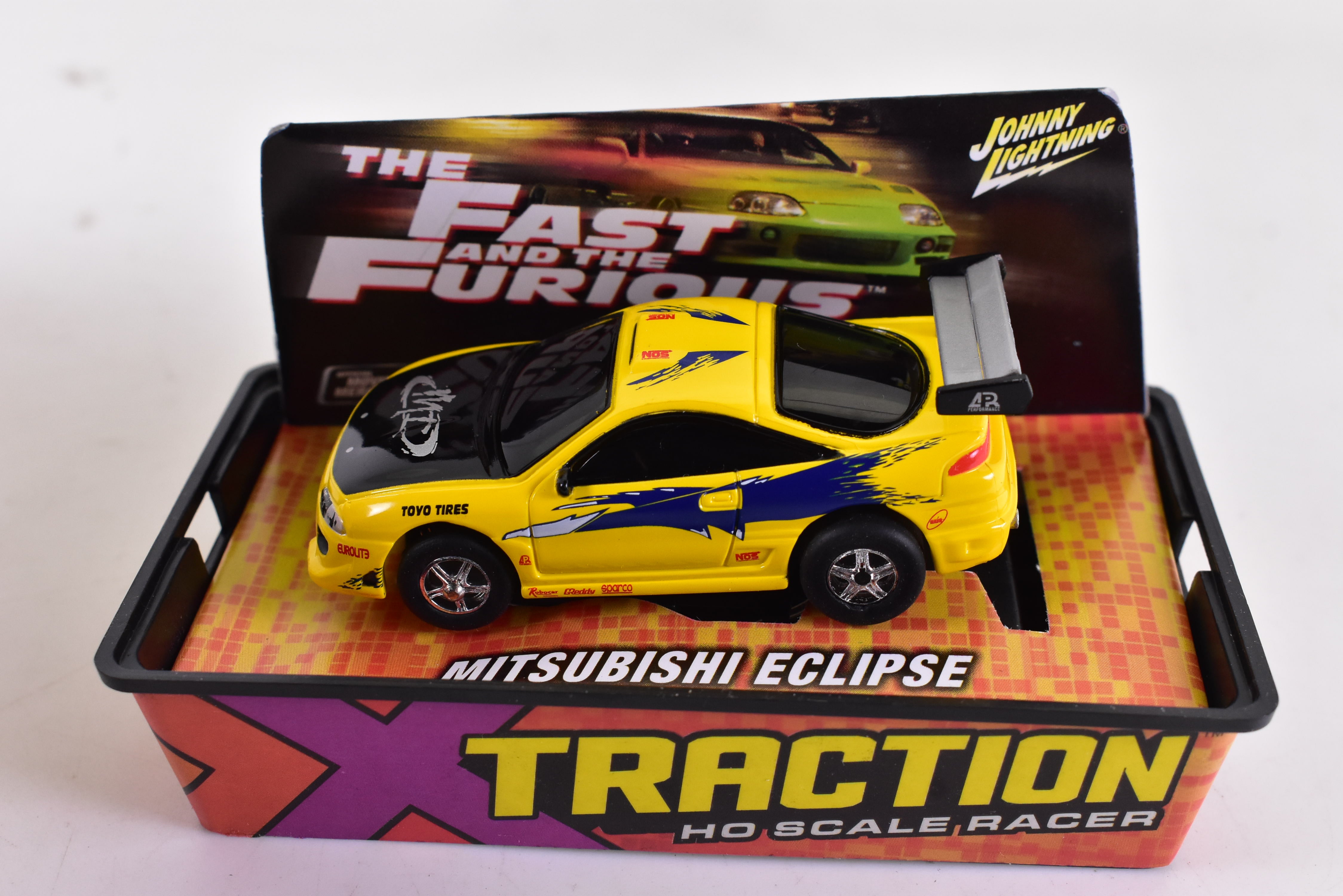 Get Your Thrills with the Stunning Yellow Mitsubishi Eclipse Ho Scale Racer by Auto World!