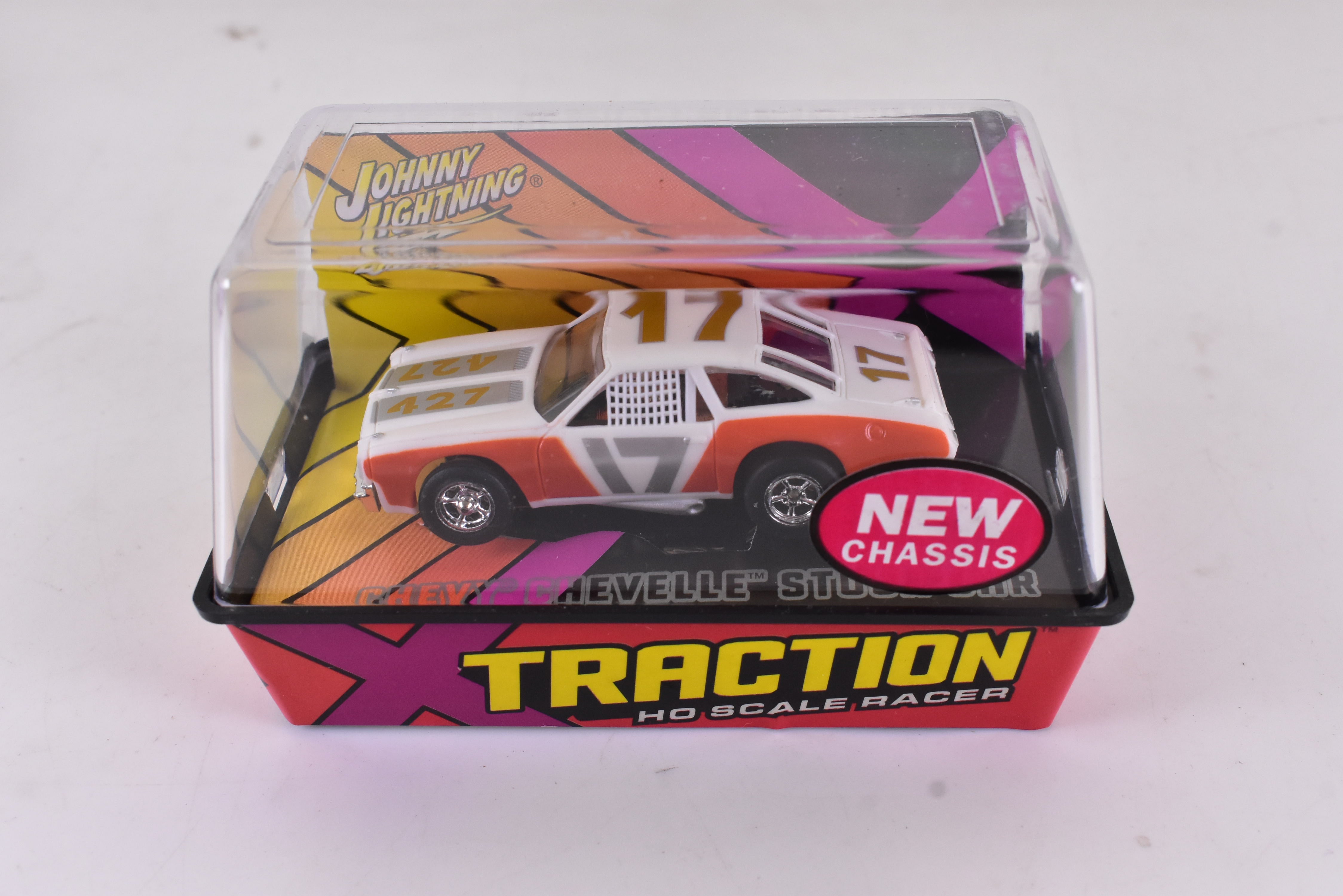 Unleash the Speed: Orange Chevy Chevelle Stock Car Ho Scale Racer with Xtraction Chassis | Auto World 401-9